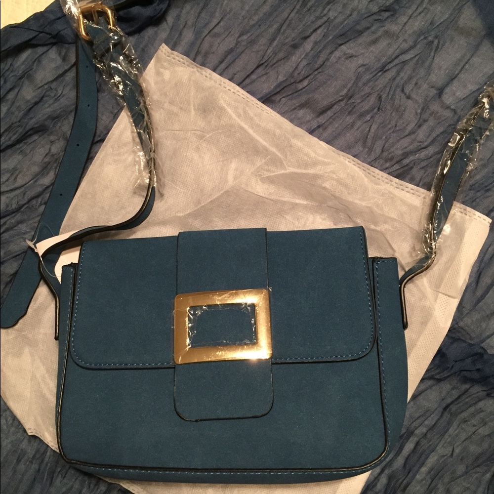 Faux leather, fold over sling bag.